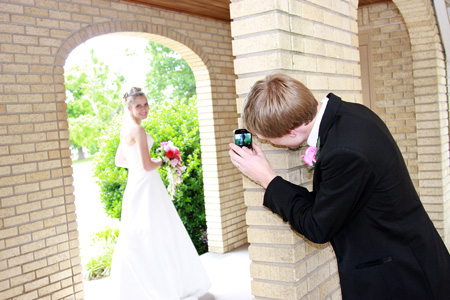 Scott tries his hand at being a photographer during Amanda's bridal portraits.